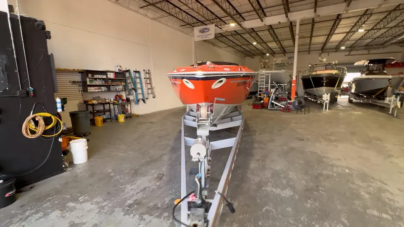 Slide: The Image of 2007 Baja 35 Outlaw boat in a spacious indoor storage facility. - 6