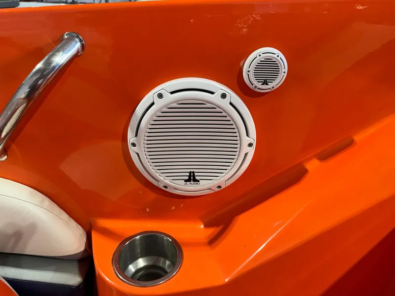 Slide: The Image of Orange interior of 2007 Baja 35 Outlaw boat with white speakers and cup holder. - 8
