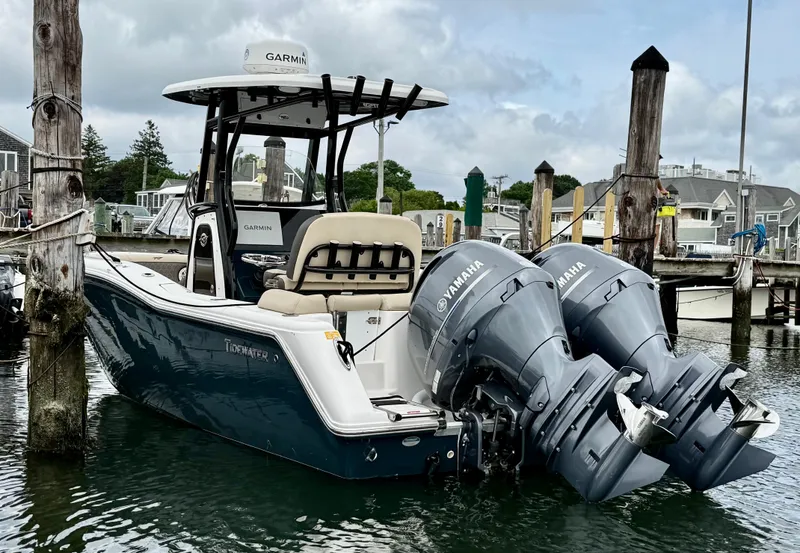 Slide: The Image of 2020 Tidewater 252 LXF boat docked, featuring dual Yamaha engines and Garmin equipment. - 4