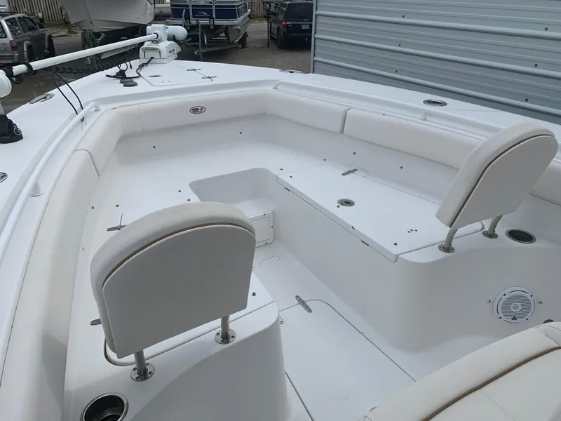 Slide: The Image of 2020 Sea Hunt Gamefish 27 Forward Seating boat interior with white cushioned seats. - 11