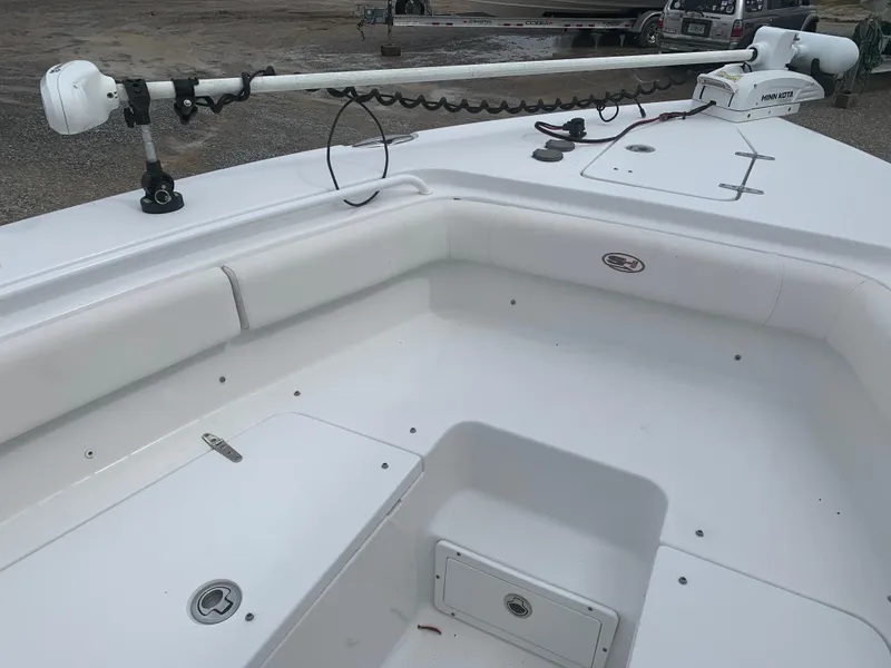 Slide: The Image of 2020 Sea Hunt Gamefish 27 Forward Seating boat interior with white cushioned seating. - 13