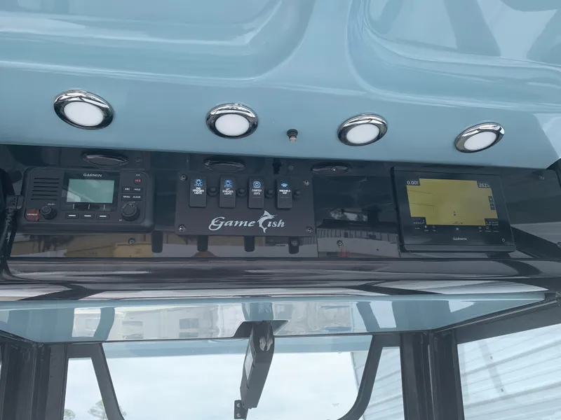 Slide: The Image of 2020 Sea Hunt Gamefish 27 dashboard with navigation and control panel. - 16