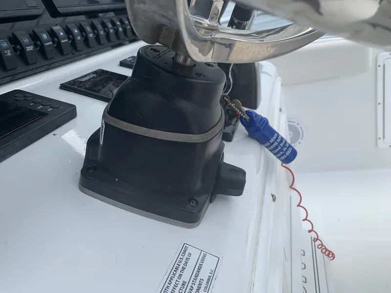 Slide: The Image of 2020 Sea Hunt Gamefish 27 helm with steering wheel and control panel. - 21