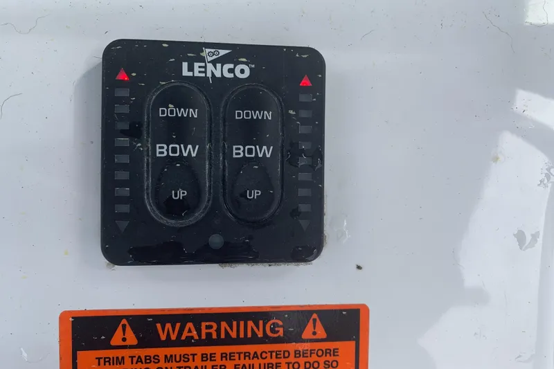 Slide: The Image of Lenco trim tab control panel on 2020 Sea Hunt Gamefish 27 boat. - 27