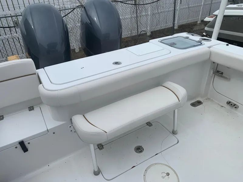 Slide: The Image of 2020 Sea Hunt Gamefish 27 boat interior with seating and dual engines. - 4