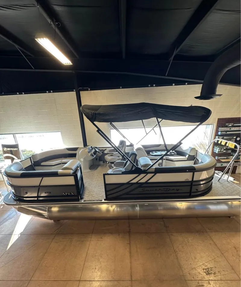 Slide: The Image of 2025 South Bay 222 RS LE Apex Edition pontoon boat in showroom. - 3