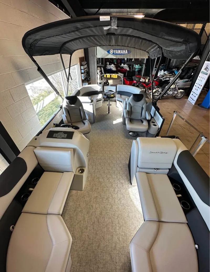 Slide: The Image of 2025 South Bay 222 RS LE Apex Edition pontoon boat with spacious seating and canopy. - 7