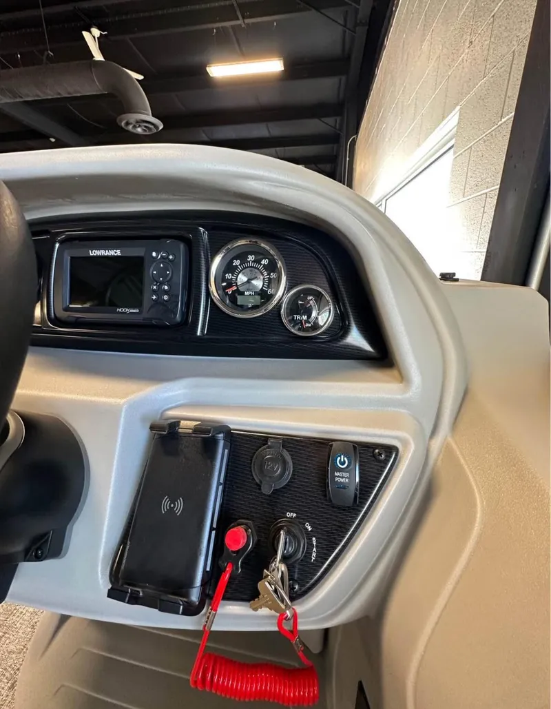 Slide: The Image of Dashboard of 2025 South Bay 222 RS LE Apex Edition boat with controls and gauges. - 9
