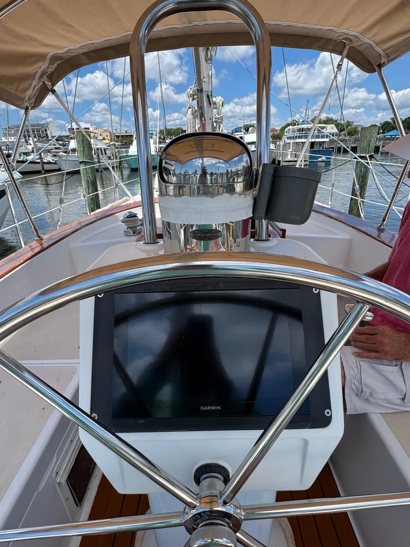 Slide: The Image of Helm of 1981 Gulfstar 44 sailboat with navigation equipment, docked at marina. - 21