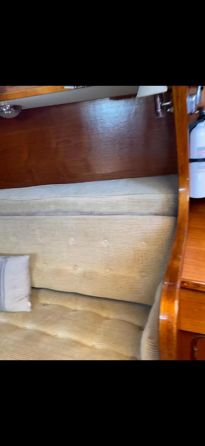 Slide: The Image of Interior of 1981 Gulfstar 44 yacht with wooden finish and beige seating. - 31