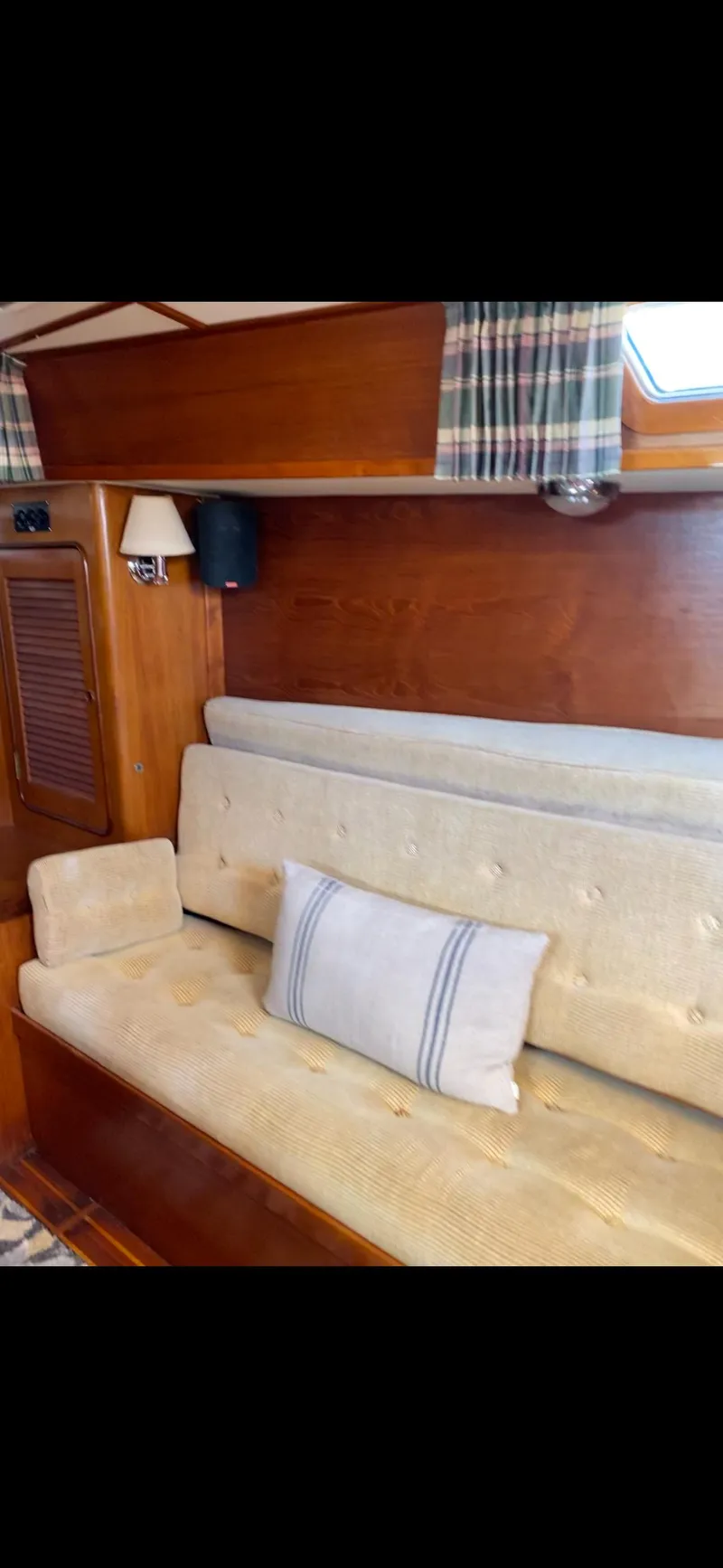Slide: The Image of Interior of 1981 Gulfstar 44 yacht with beige seating and wooden paneling. - 33