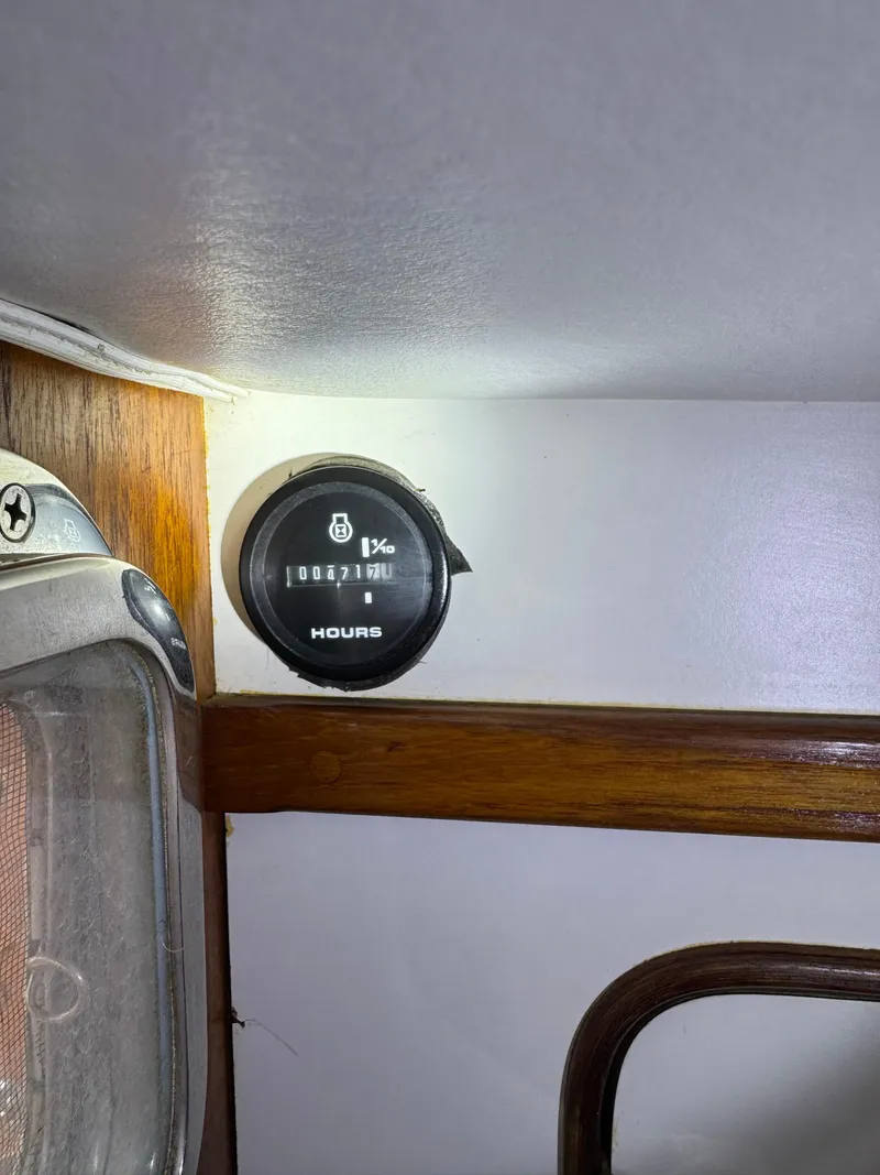 Slide: The Image of Hour meter on 1981 Gulfstar 44 boat interior, mounted on wooden panel. - 35