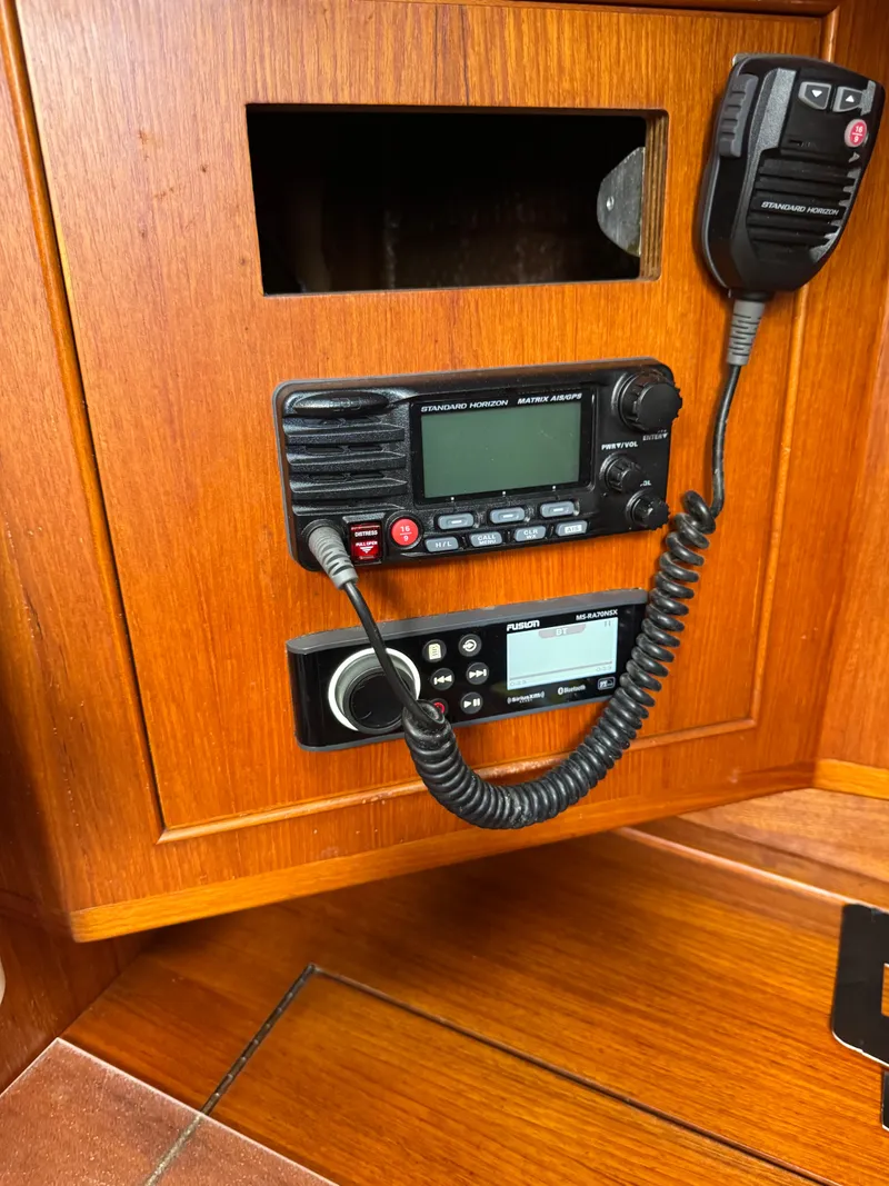 Slide: The Image of 1981 Gulfstar 44 yacht radio and communication equipment on wooden panel. - 37