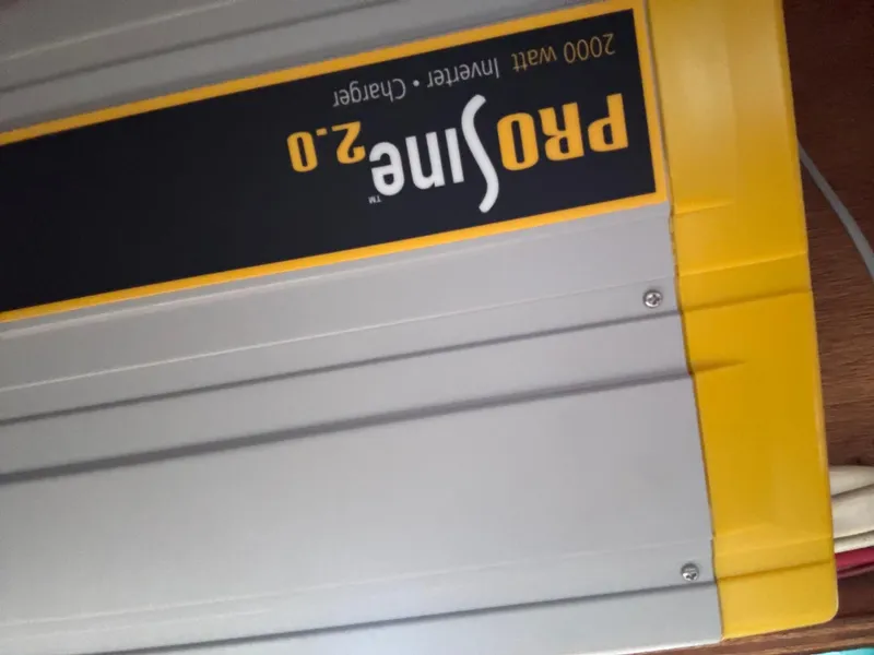 Slide: The Image of ProSine 2.0 inverter charger, 2000 watt, yellow and gray casing, Gulfstar 44, 1981 model. - 38