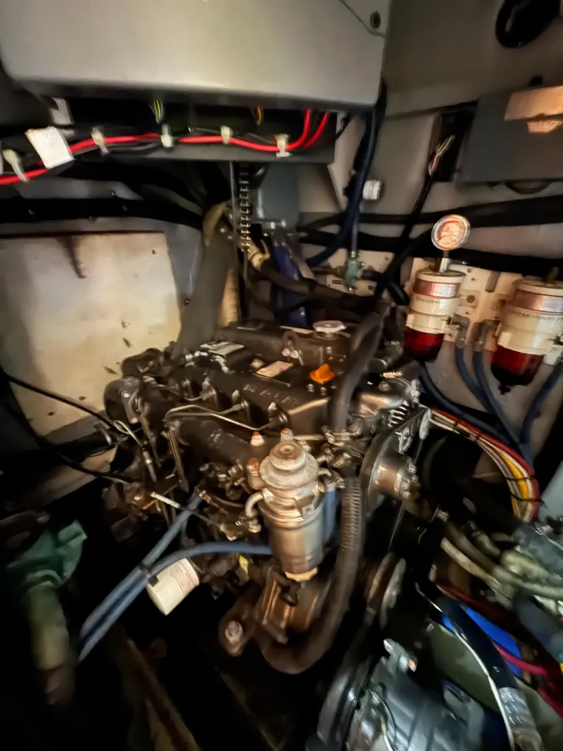 Slide: The Image of Engine room of a 1981 Gulfstar 44 yacht, showcasing complex wiring and components. - 39