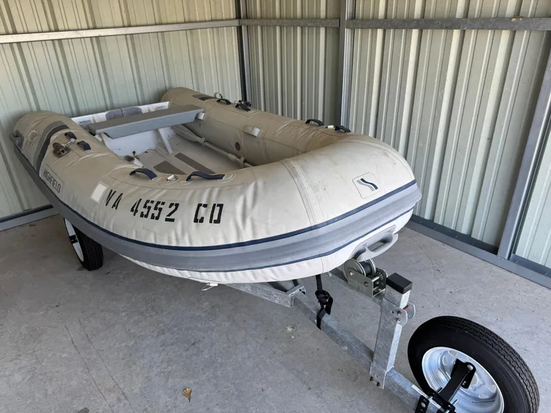 Slide: The Image of Inflatable boat on trailer in metal shed, Gulfstar 44, 1981 model. - 41