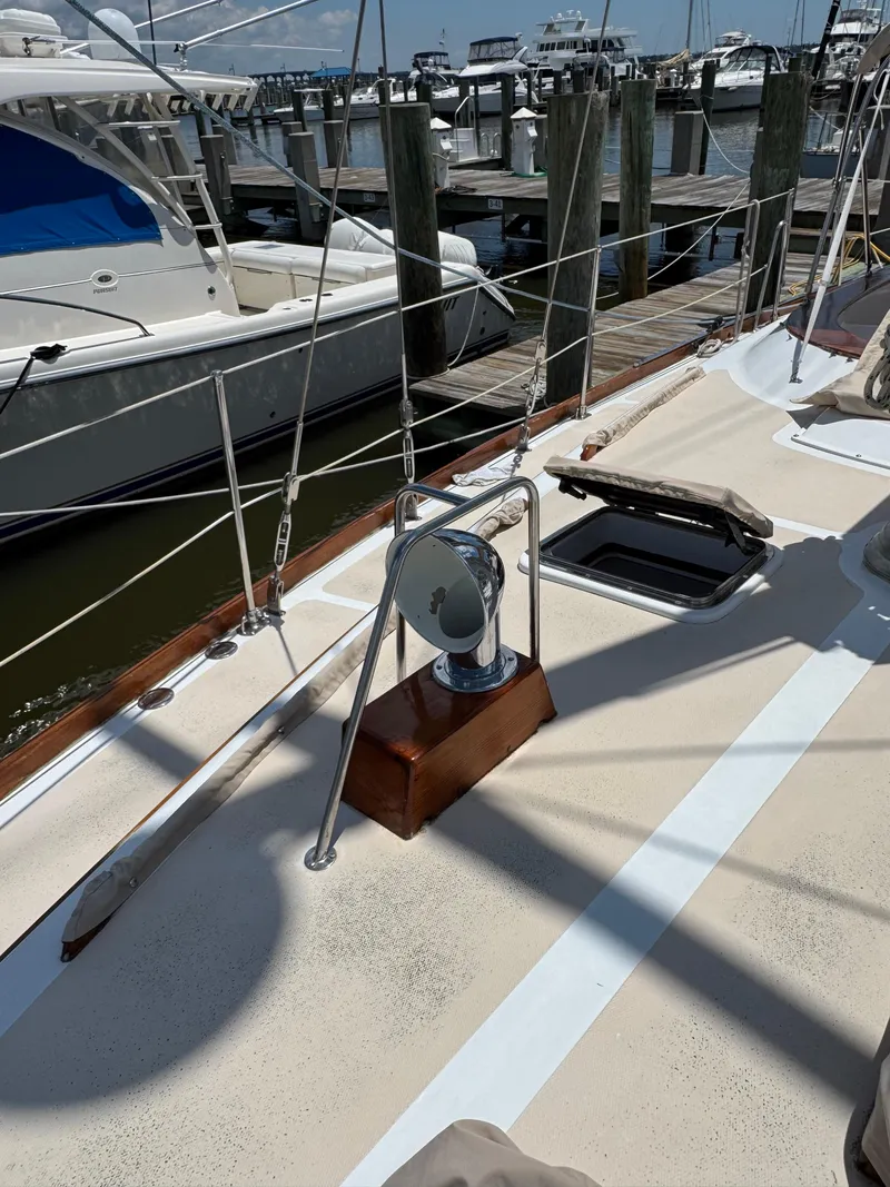 Slide: The Image of 1981 Gulfstar 44 sailboat deck with winch, docked at marina. - 9