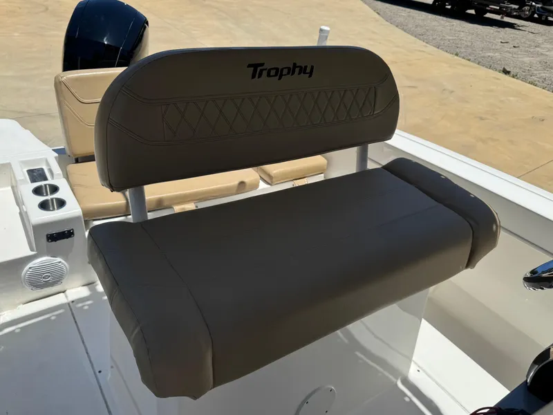 Slide: The Image of 2022 Bayliner Trophy T20CC boat seat with "Trophy" logo, featuring beige upholstery. - 5