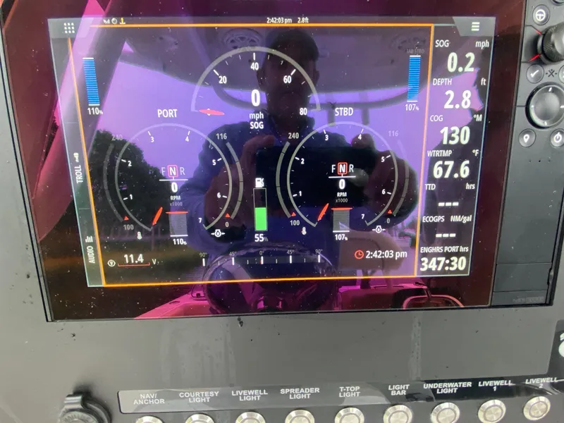 Slide: The Image of 2018 Sportsman Heritage 251 Center Console dashboard displaying navigation and engine metrics. - 9