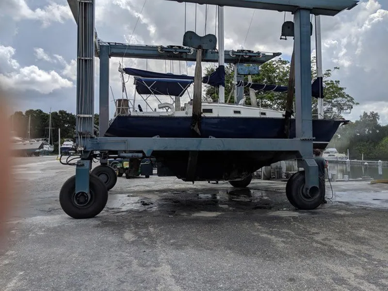 Slide: The Image of 1982 Custom Wings 33 Ketch sailboat on a lift at a marina. - 17