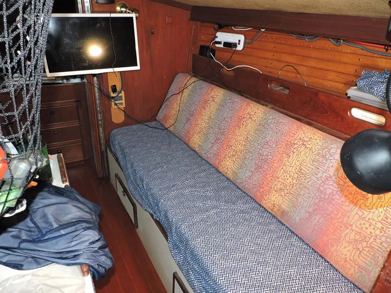 Slide: The Image of Interior of 1982 Custom Wings 33 Ketch with colorful seating and mounted TV. - 5