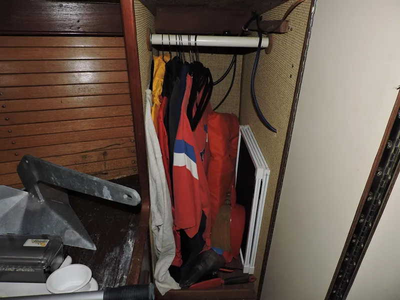 Slide: The Image of Storage area on a 1982 Custom Wings 33 Ketch with hanging jackets and equipment. - 8
