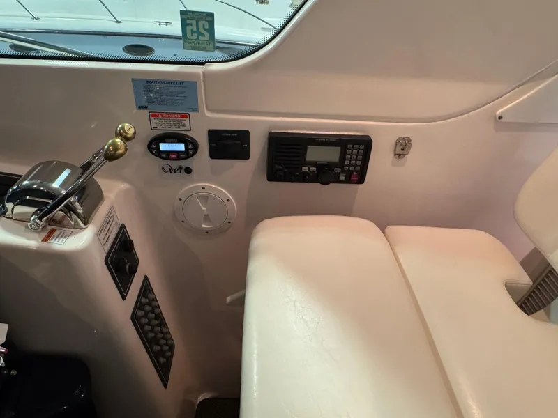 Slide: The Image of 2004 Tiara Yachts 3600 Sovran helm with controls and navigation equipment. - 12