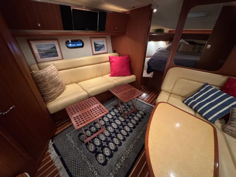 Slide: The Image of Luxurious interior of 2004 Tiara Yachts 3600 Sovran with cozy seating and elegant decor. - 16