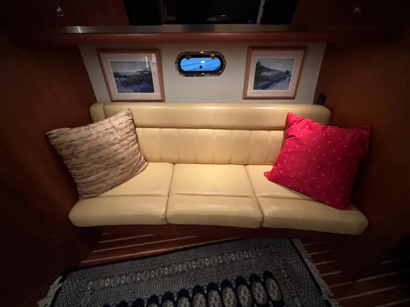 Slide: The Image of Luxurious 2004 Tiara Yachts 3600 Sovran interior with cozy seating and decorative pillows. - 21
