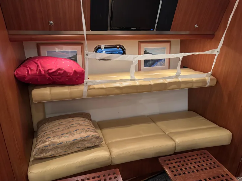 Slide: The Image of Interior of 2004 Tiara Yachts 3600 Sovran with bunk beds and wooden cabinetry. - 25