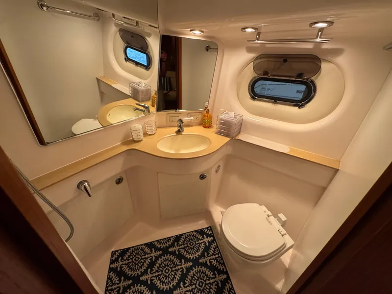 Slide: The Image of Luxurious 2004 Tiara Yachts 3600 Sovran bathroom with modern fixtures and elegant design. - 29