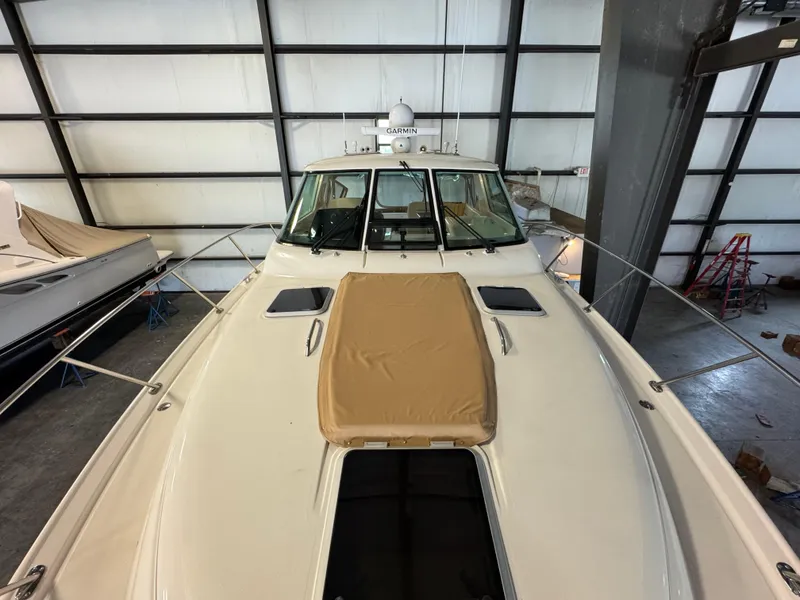 Slide: The Image of 2004 Tiara Yachts 3600 Sovran in storage, showcasing sleek design and spacious deck. - 31