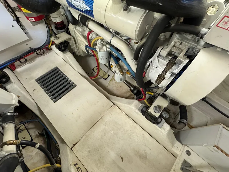 Slide: The Image of Engine compartment of 2004 Tiara Yachts 3600 Sovran, showcasing mechanical components and wiring. - 35