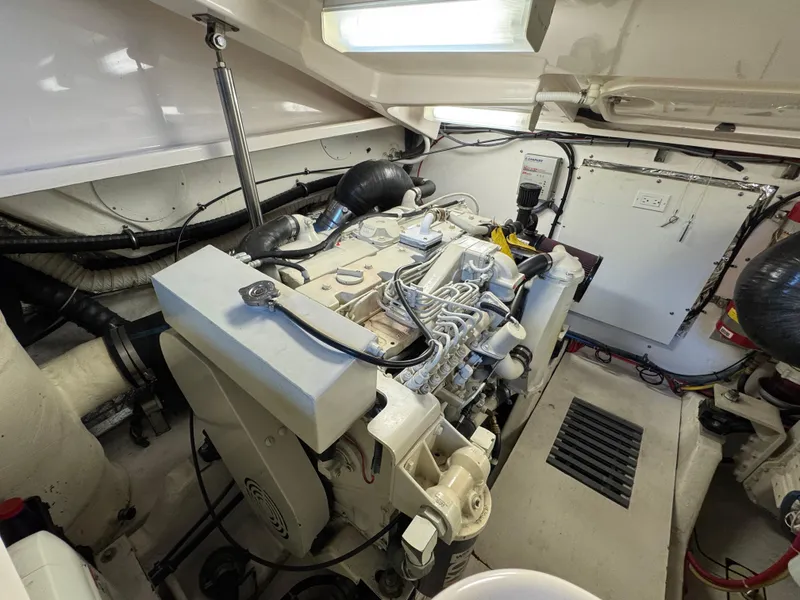 Slide: The Image of Engine room of 2004 Tiara Yachts 3600 Sovran, showcasing mechanical components and wiring. - 39