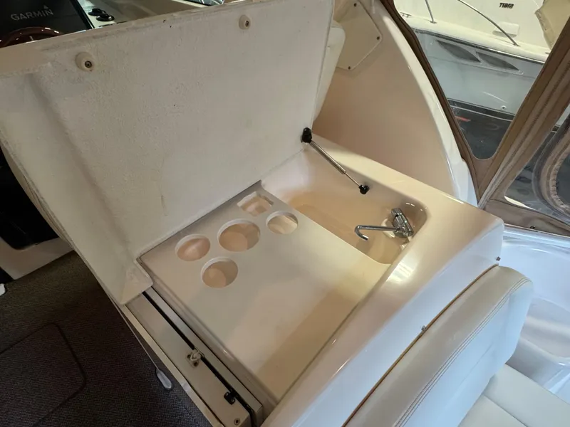 Slide: The Image of 2004 Tiara Yachts 3600 Sovran interior with built-in sink and cup holders. - 9