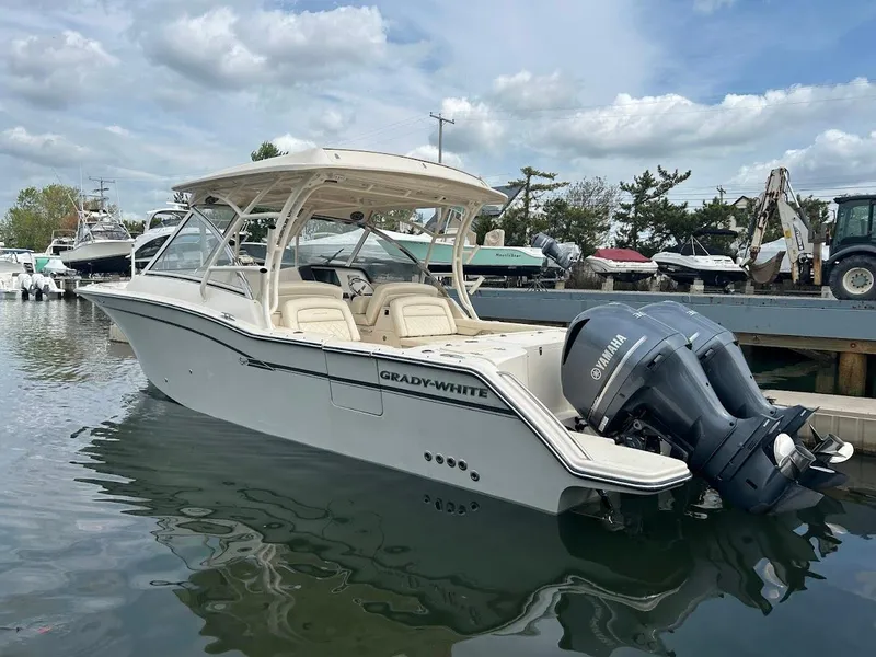 The Image of 2019 Grady-White Freedom 325 boat docked, featuring Yamaha outboard engines. - 0