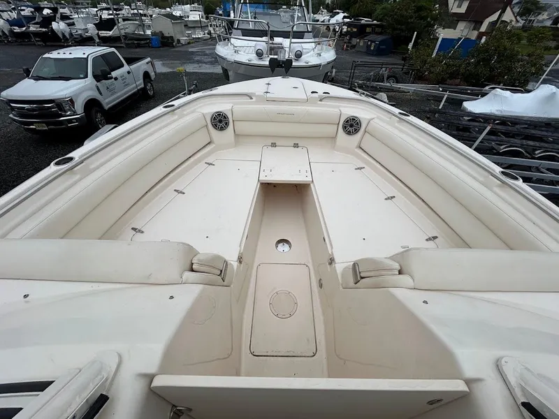 Slide: The Image of 2019 Grady-White Freedom 325 boat interior with spacious seating and storage. - 6