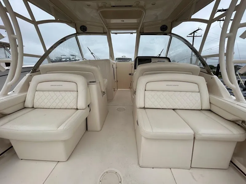 Slide: The Image of 2019 Grady-White Freedom 325 boat interior with luxurious seating and spacious design. - 7