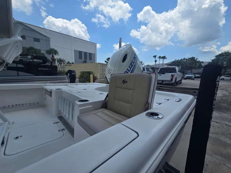 Slide: The Image of 2021 Sea Pro 228 Bay boat with seating, docked under a partly cloudy sky. - 8