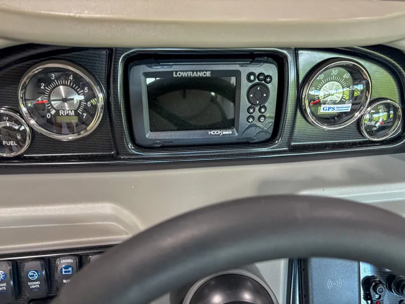 Slide: The Image of Dashboard of 2025 Trifecta 22 RF LE with gauges and Lowrance GPS system. - 11