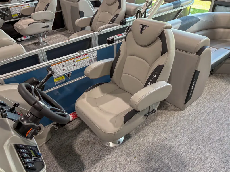 Slide: The Image of Captain's chair in 2025 Trifecta 22 RF LE pontoon boat interior. - 6