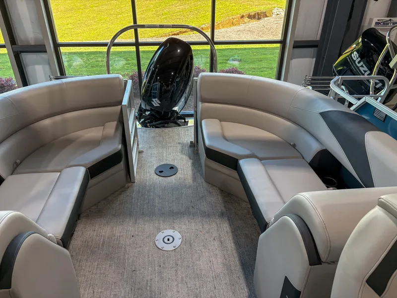 Slide: The Image of 2025 Trifecta 22 RF LE pontoon boat interior with plush seating and modern design. - 7