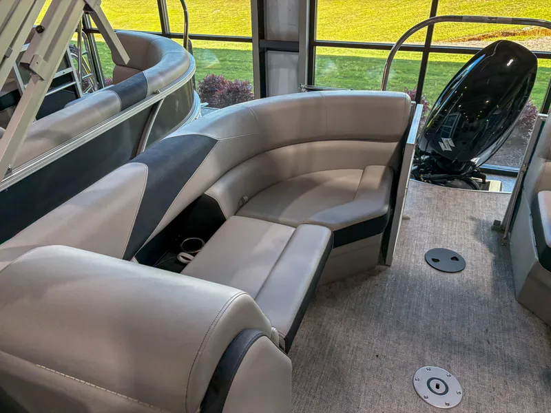 Slide: The Image of 2025 Trifecta 22 RF LE pontoon boat interior with plush seating and modern design. - 9
