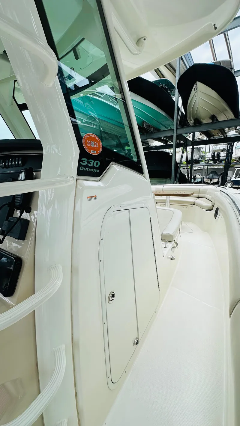Slide: The Image of 2020 Boston Whaler 330 Outrage boat interior with sleek design and modern features. - 8