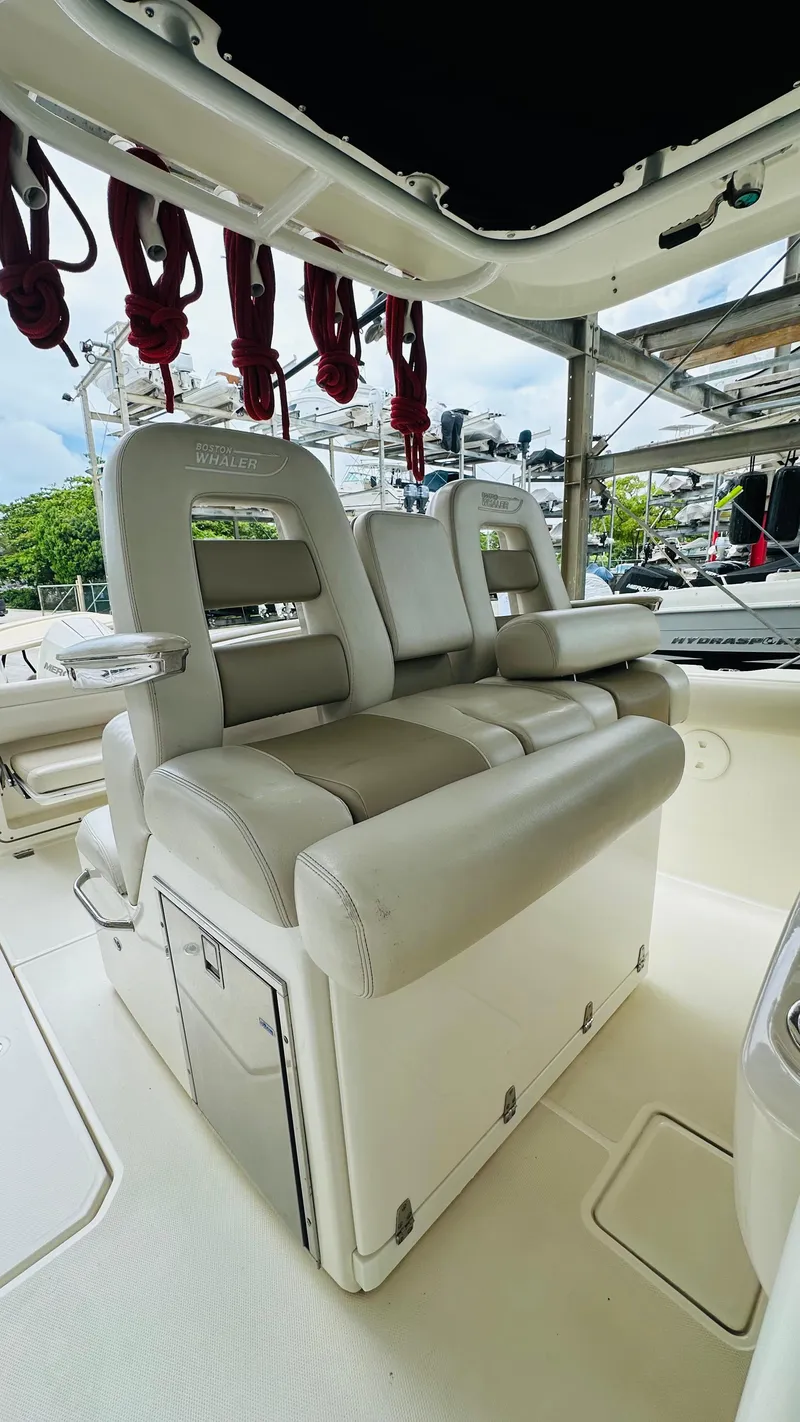 Slide: The Image of Luxury seating on 2020 Boston Whaler 330 Outrage boat, featuring plush, ergonomic design. - 9