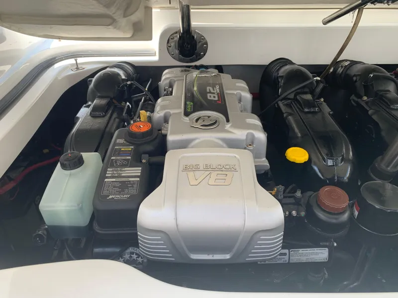 Slide: The Image of Engine compartment of a 2014 Cobalt 302 boat featuring a powerful V8 engine. - 30