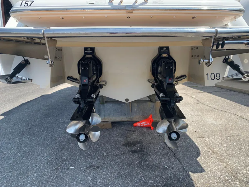 Slide: The Image of Rear view of a 2014 Cobalt 302 boat with dual propellers. - 5