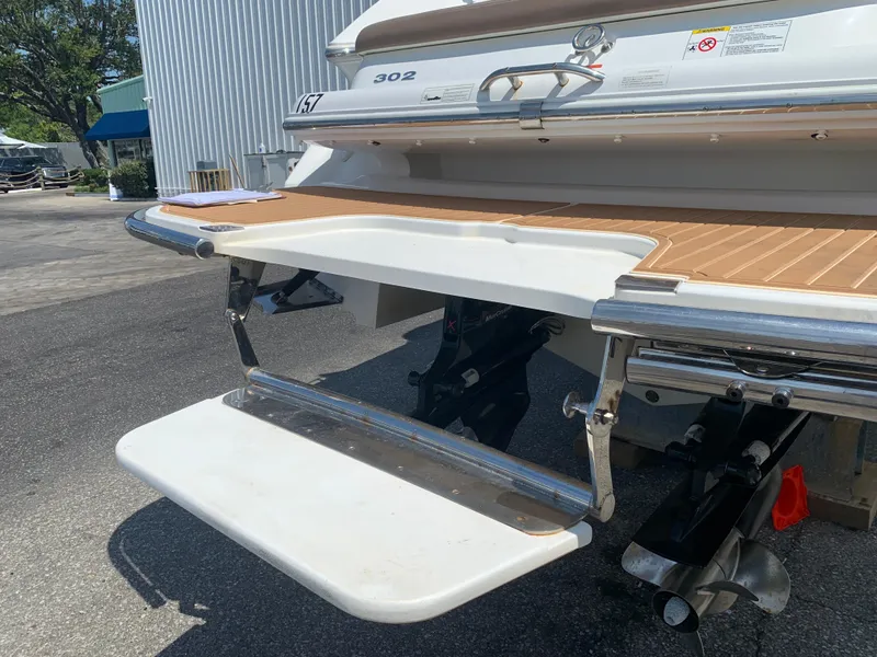 Slide: The Image of 2014 Cobalt 302 boat with extended swim platform and ladder. - 9