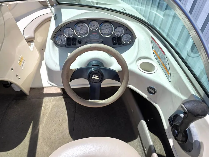 Slide: The Image of 2003 Sea Ray 176 SRX BR boat dashboard with steering wheel and instrument panel. - 11