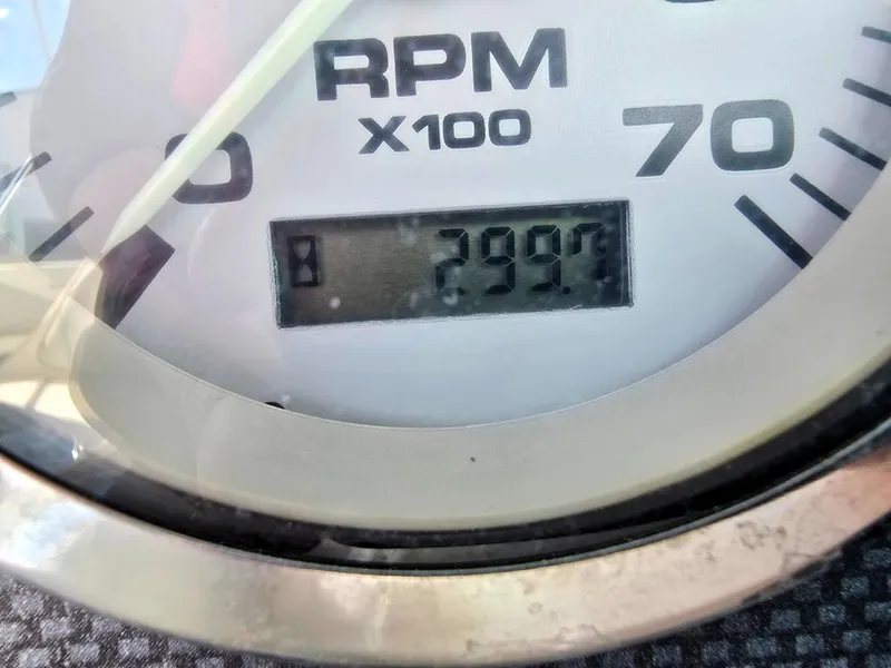 Slide: The Image of Close-up of a 2003 Sea Ray 176 SRX BR tachometer showing 299.7 RPM. - 13